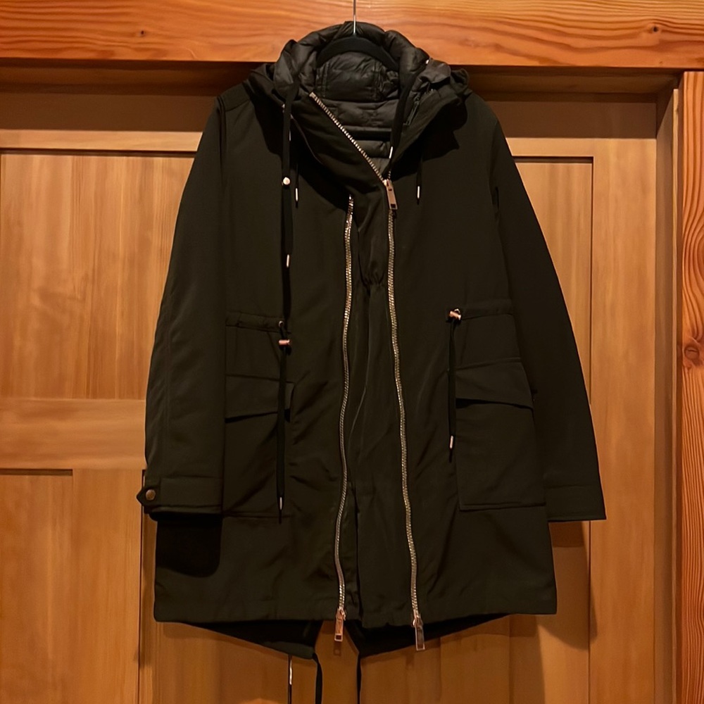 Dark olive green maternity jacket. Additional front panel.